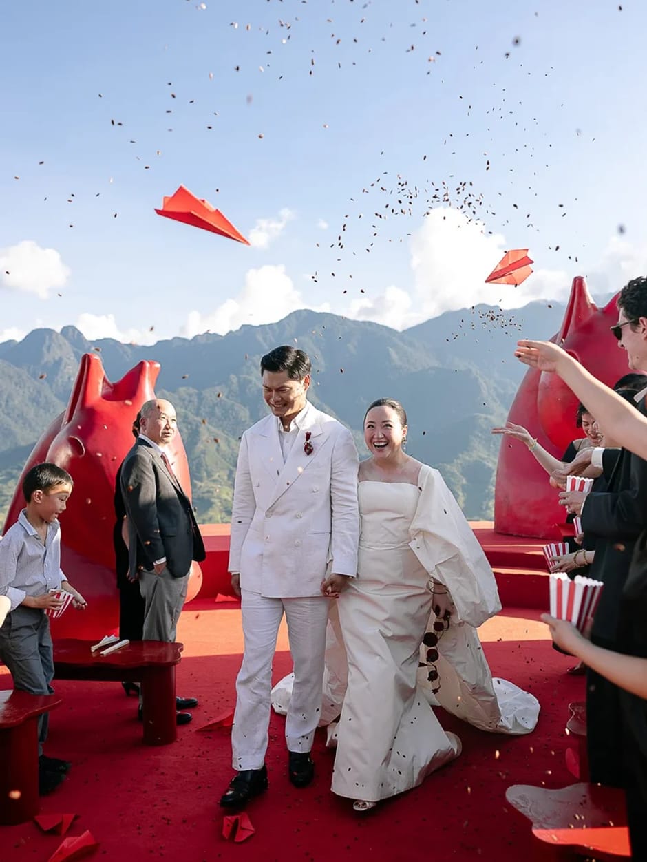 Bride and groom celebrating with confetti at a mountain venue